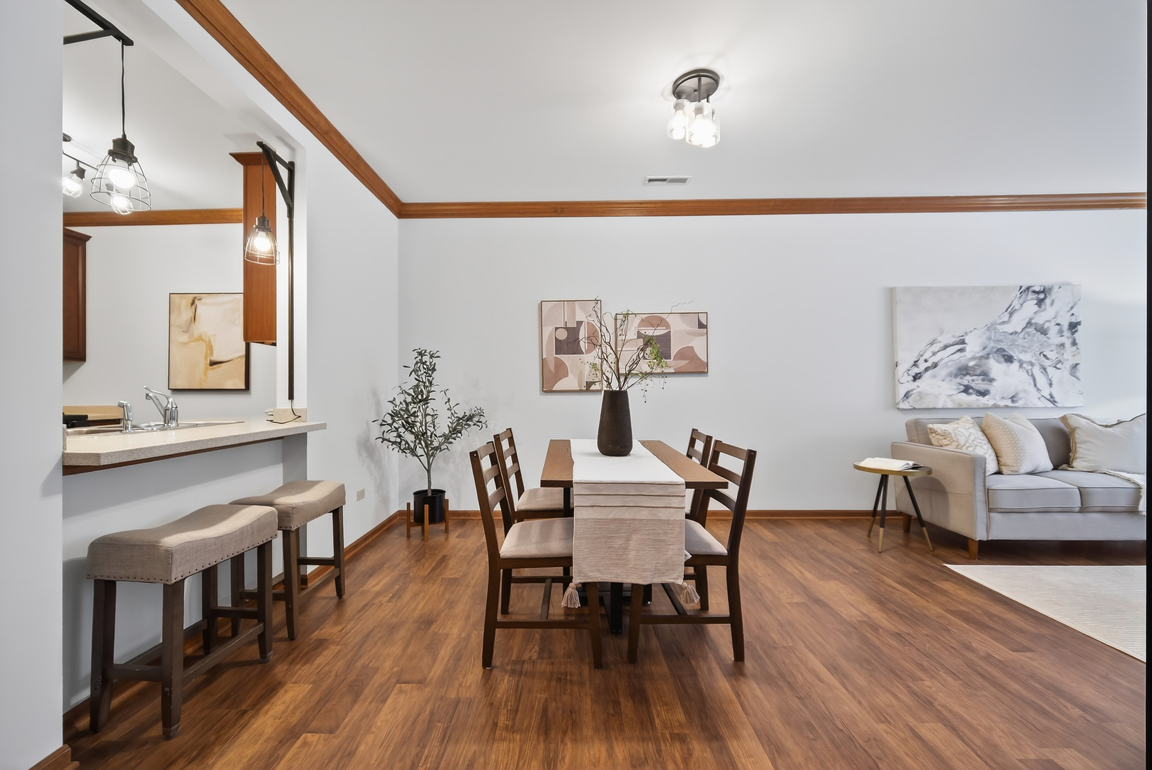 10 Ford Street, Unit 103 Geneva, IL 60134 - Photo 8 of 18 a dining room with furniture and wooden floor