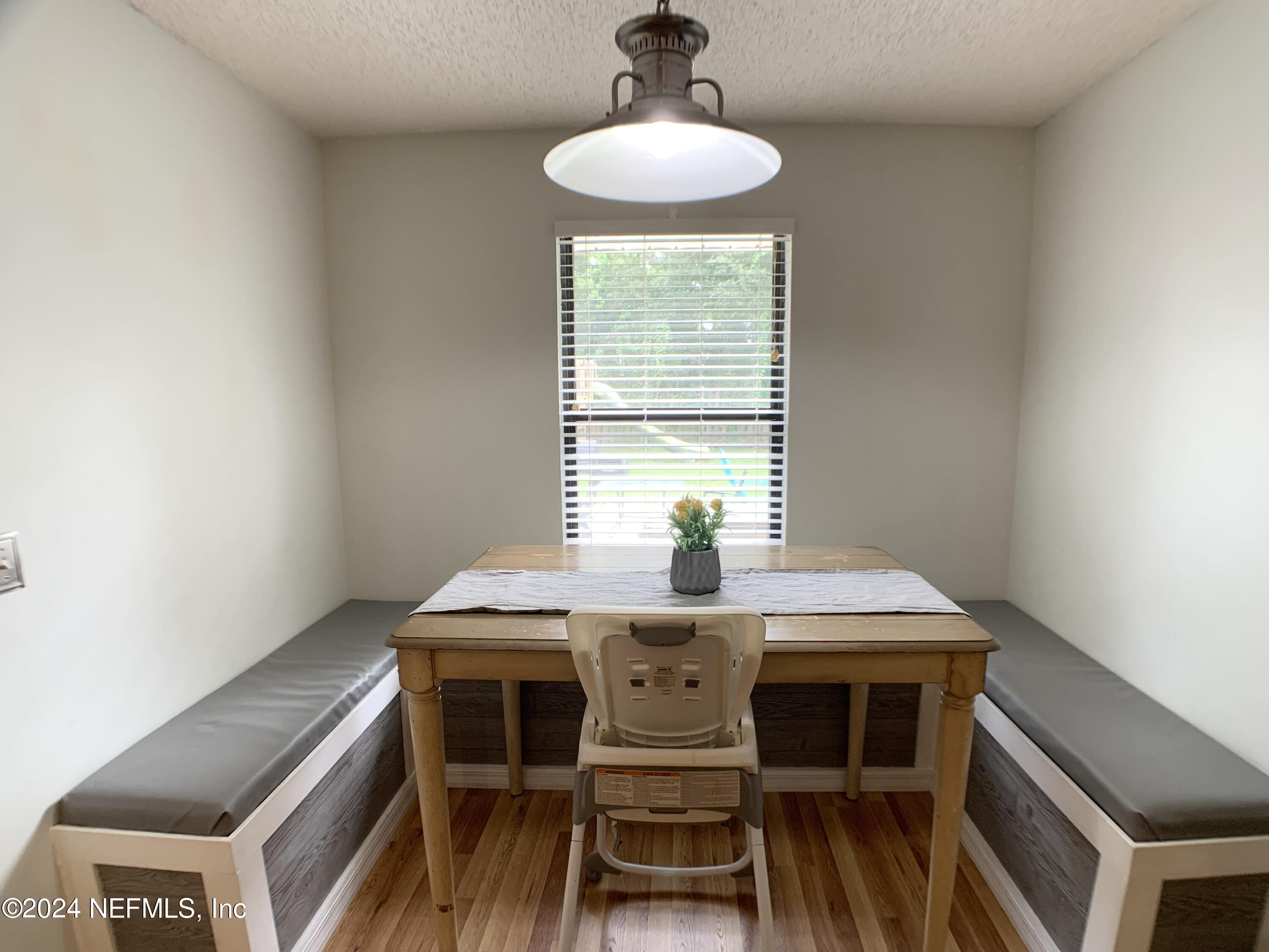 3149 Lakeside Villa Road Orange Park, FL 32073 - Photo 13 of 42 a dining room with a table and chairs