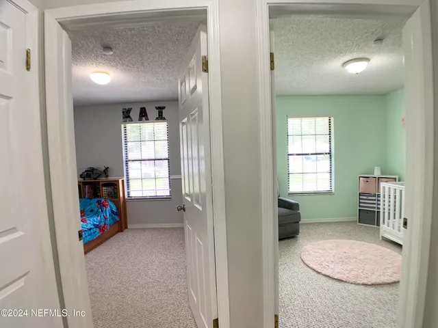 a view of livingroom with furniture and a window