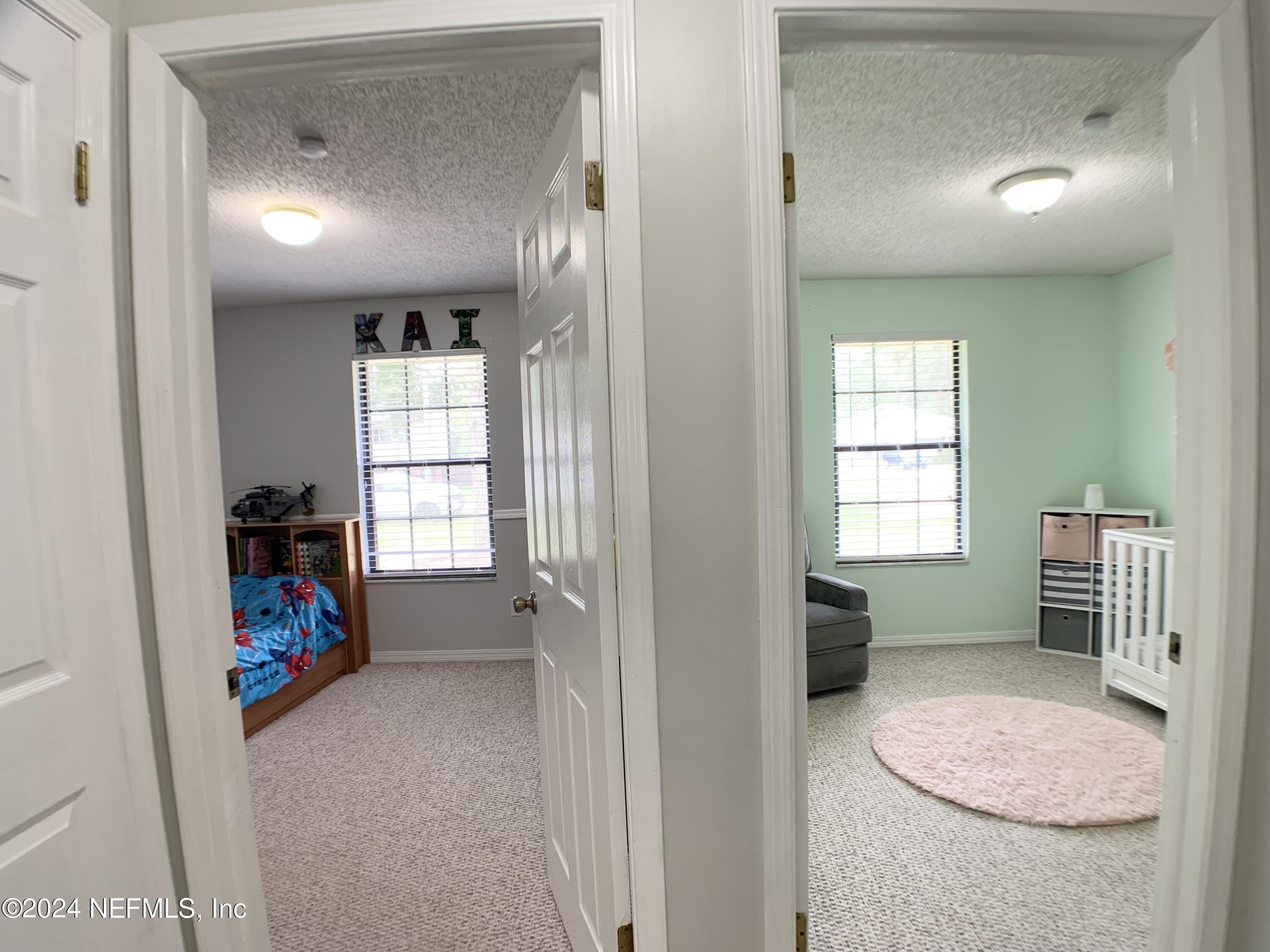 3149 Lakeside Villa Road Orange Park, FL 32073 - Photo 14 of 42 a view of livingroom with furniture and a window