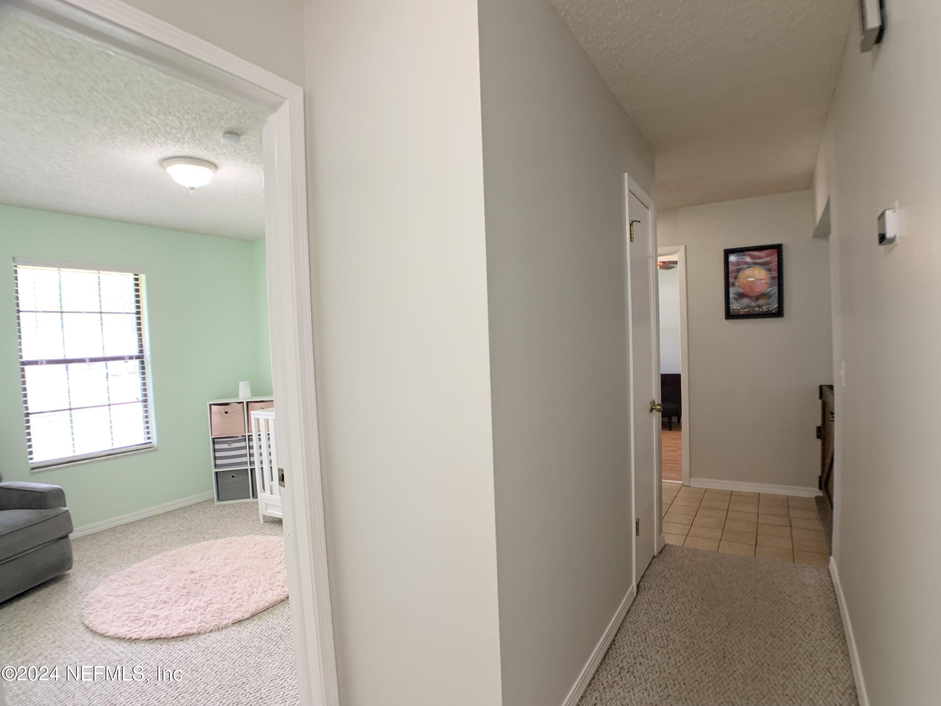 3149 Lakeside Villa Road Orange Park, FL 32073 - Photo 15 of 42 an empty room with windows and closet