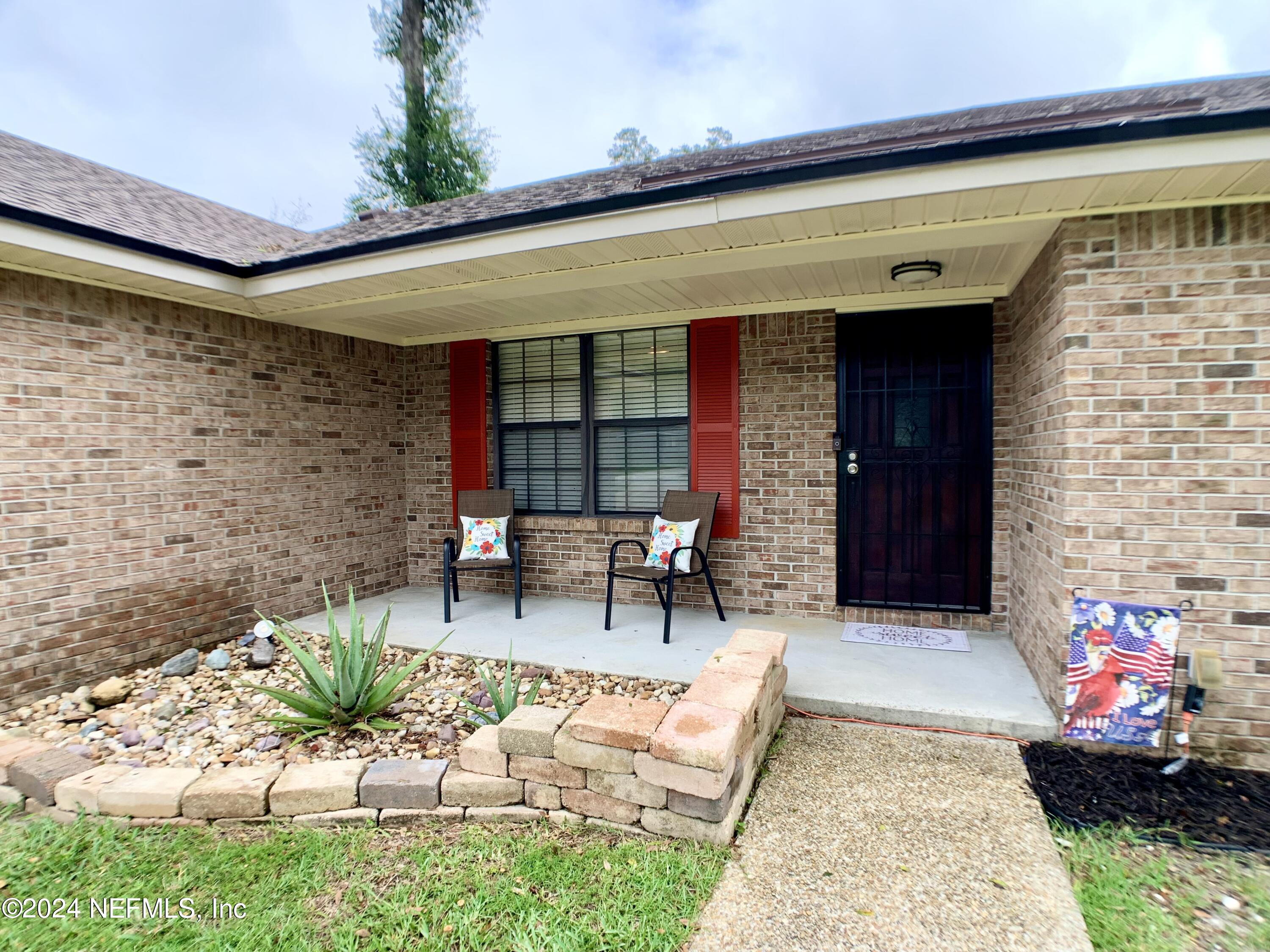 3149 Lakeside Villa Road Orange Park, FL 32073 - Photo 4 of 42 a view of two chairs in patio of the house