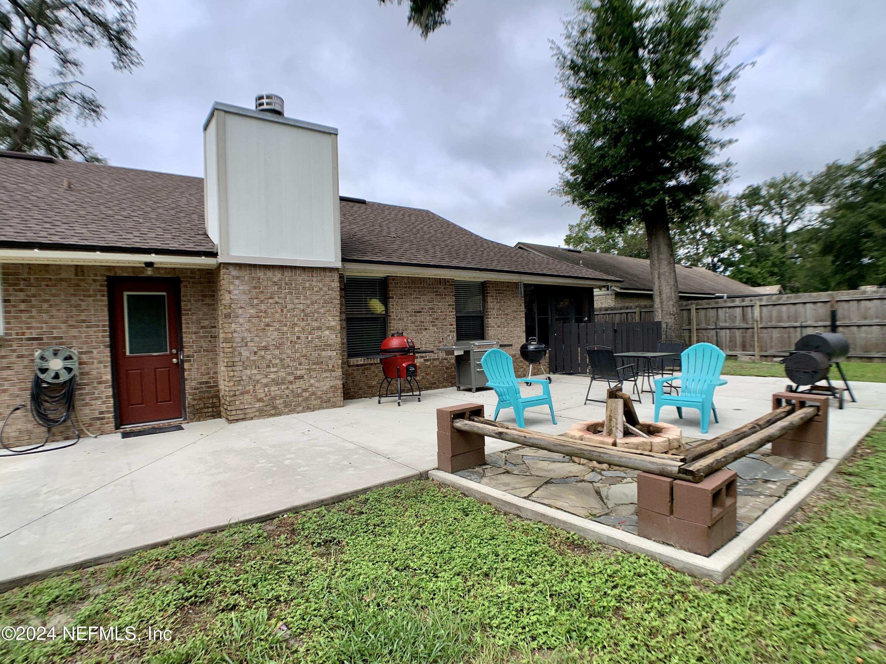 3149 Lakeside Villa Road Orange Park, FL 32073 - Photo 41 of 42 a view of a house with backyard and sitting area