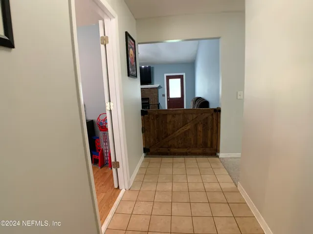 a view of a closet area with fireplace