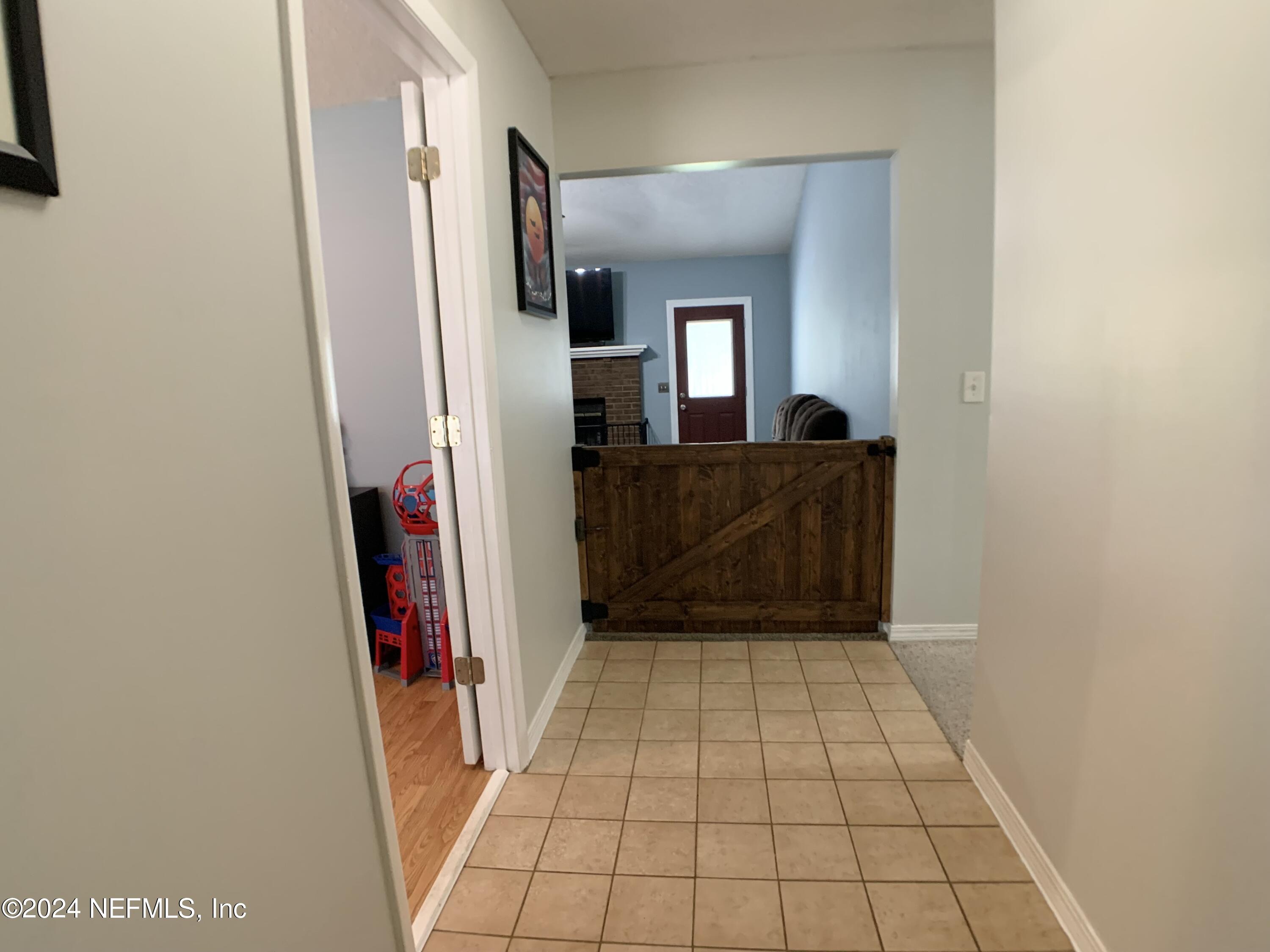 3149 Lakeside Villa Road Orange Park, FL 32073 - Photo 5 of 42 a view of a closet area with fireplace