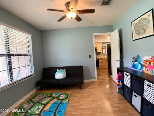 a living room with furniture and a window