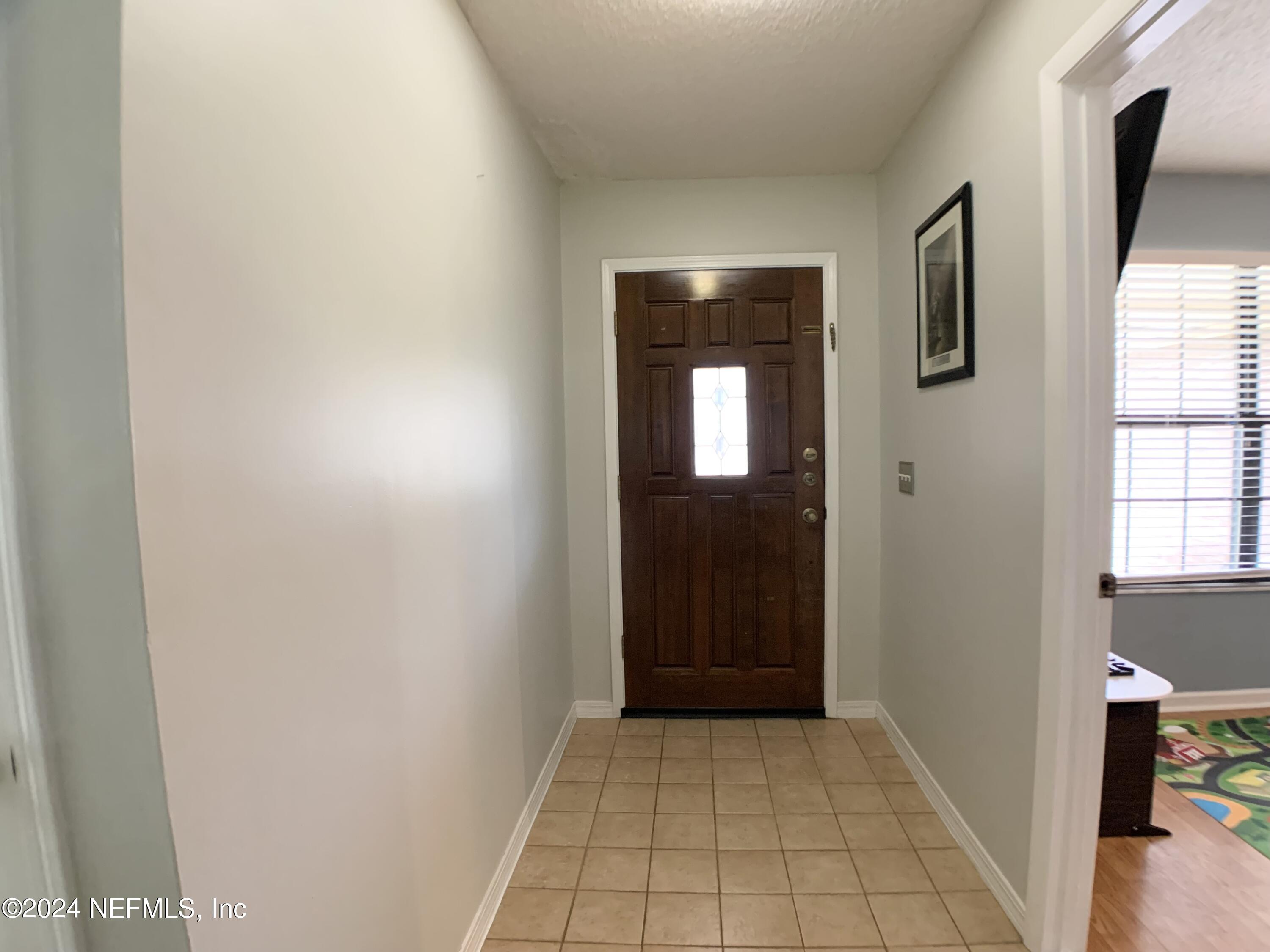 3149 Lakeside Villa Road Orange Park, FL 32073 - Photo 8 of 42 a view of an entryway door