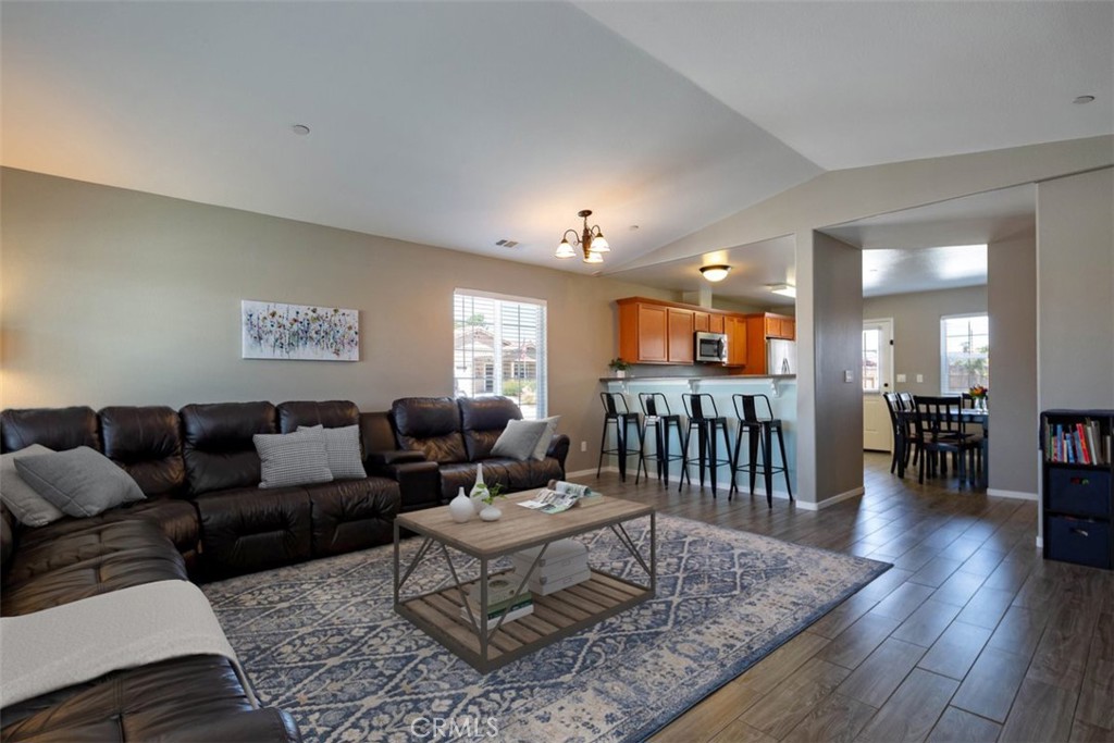 664 Chick Lane San Miguel, CA 93451 - Photo 13 of 14 a living room with furniture a wooden floor and a chandelier