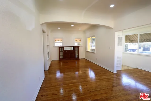 a view of kitchen with furniture and wooden floor