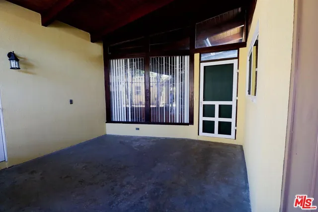 a view of empty room with windows