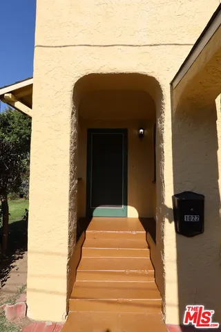 a lamp on the side of a building