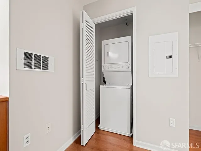 a view of storage and utility room with closet