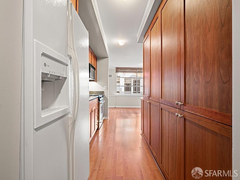 1701 Jackson Street, Unit 105 San Francisco, CA 94109 - Photo 17 of 43 a view of a hallway with wooden floor and staircase