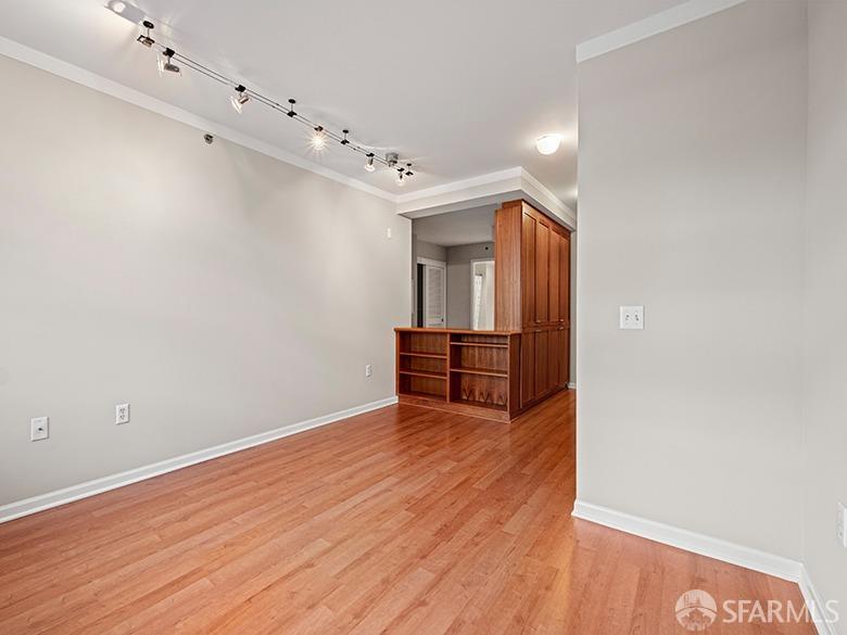1701 Jackson Street, Unit 105 San Francisco, CA 94109 - Photo 21 of 43 a view of an empty room with wooden floor