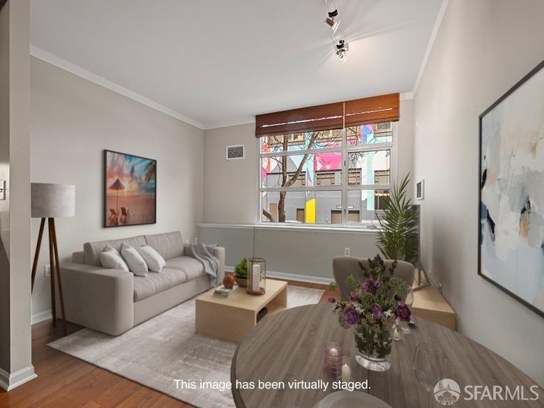 1701 Jackson Street, Unit 105 San Francisco, CA 94109 - Photo 23 of 43 a living room with furniture and wooden floor