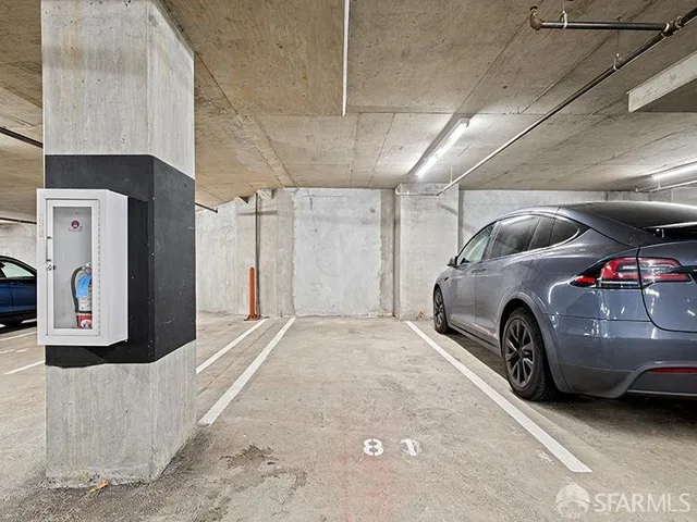 a view of parking with cars parked