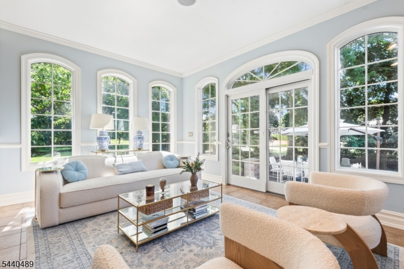 99 East Lindsley Road Cedar Grove, NJ 07009 - Photo 13 of 41 a living room with furniture and a large window