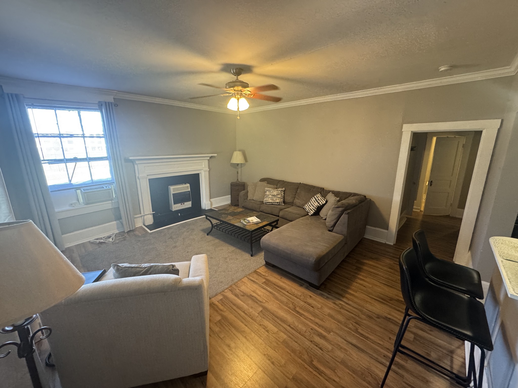 226 North Highland Avenue, Unit 4 Murfreesboro, TN 37130 - Photo 3 of 9 a living room with furniture and a fireplace