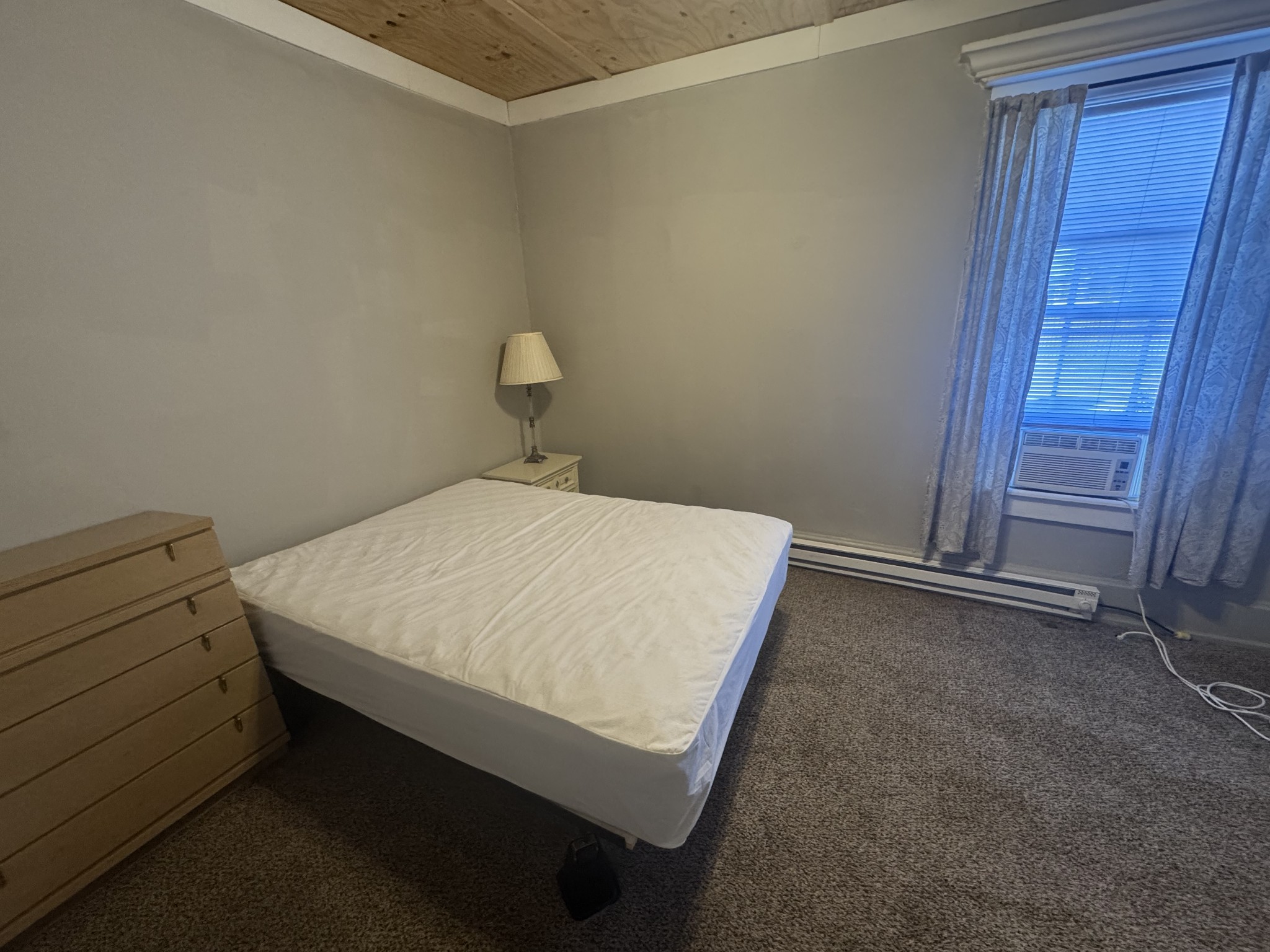 226 North Highland Avenue, Unit 4 Murfreesboro, TN 37130 - Photo 5 of 9 a bedroom with a bed and a window