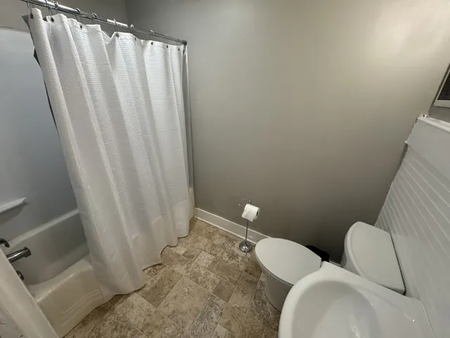 a bathroom with sink and toilet