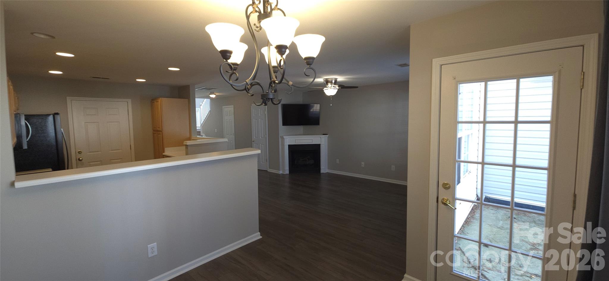 11542 Rabbit Ridge Road Charlotte, NC 28270 - Photo 12 of 33 a view of a kitchen with a sink wooden floor and a chandelier