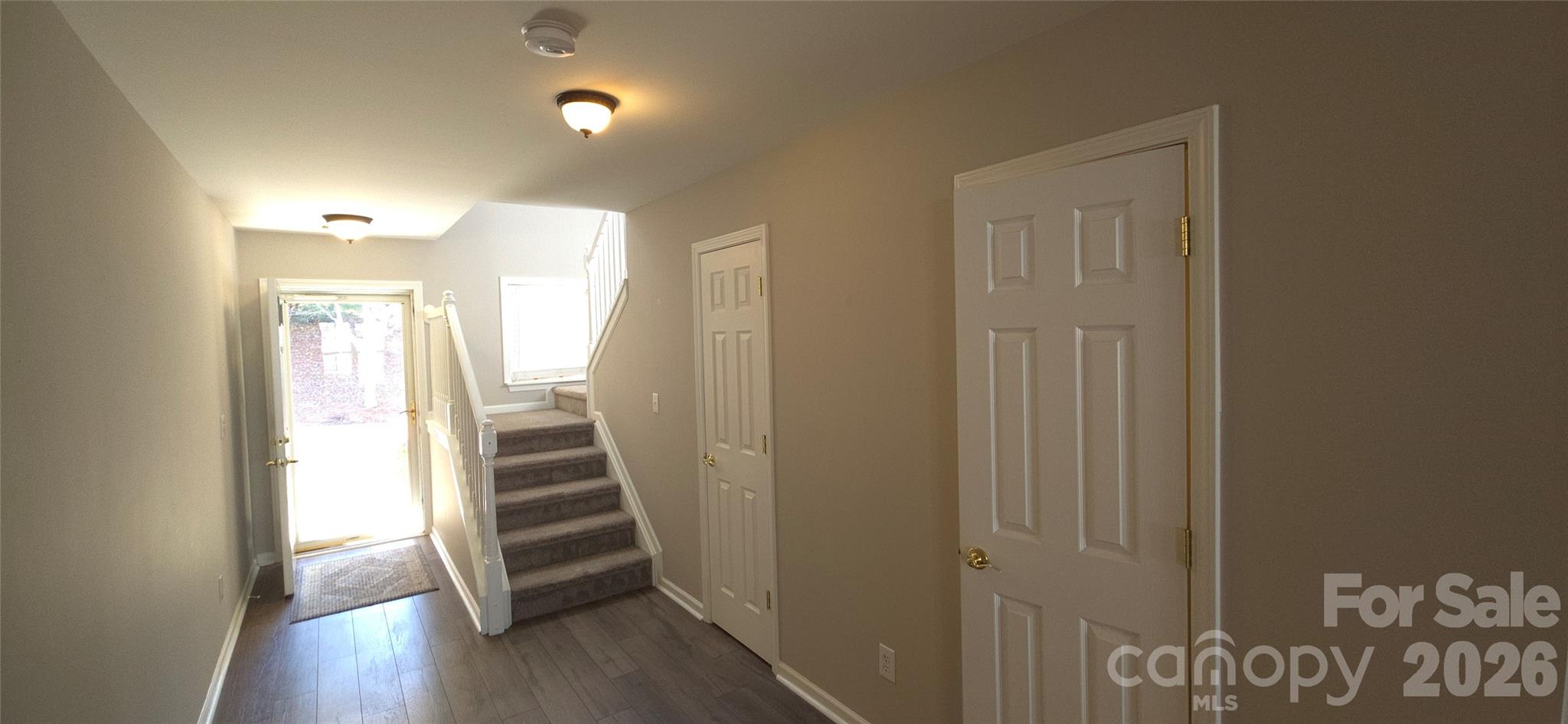 11542 Rabbit Ridge Road Charlotte, NC 28270 - Photo 13 of 33 a view of a hallway with wooden floor and stairs