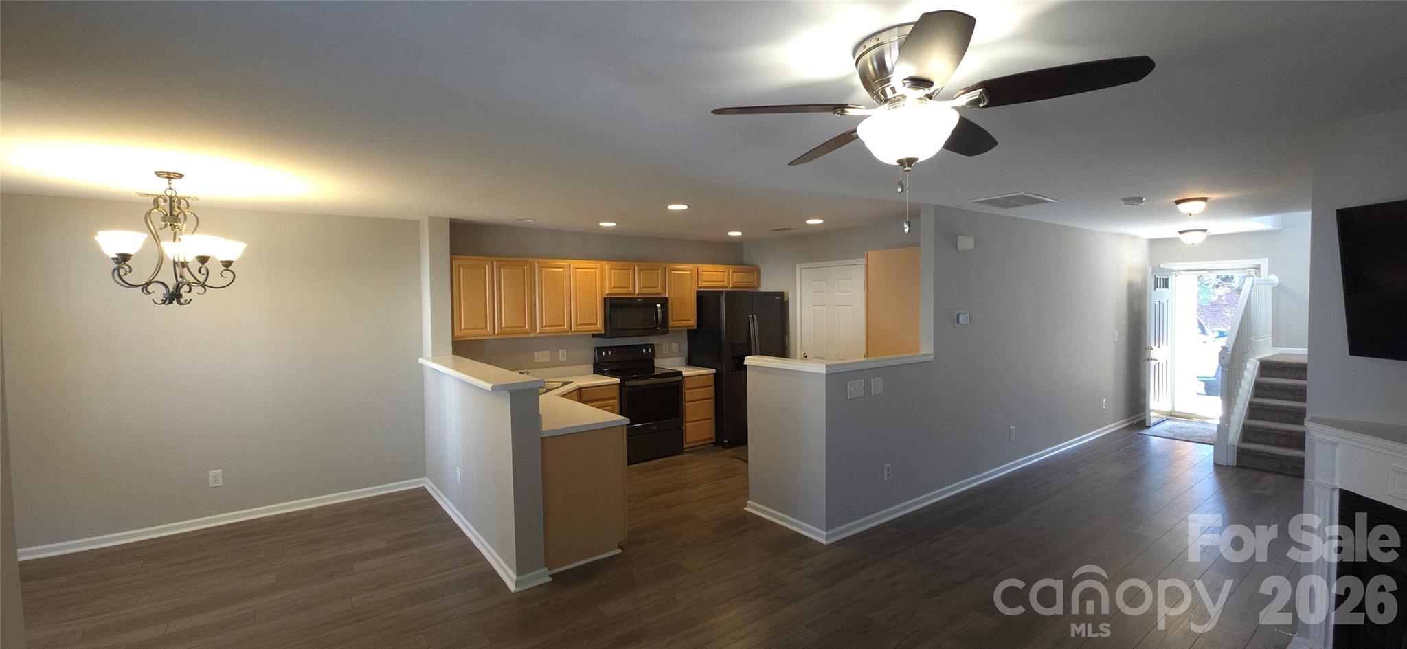 11542 Rabbit Ridge Road Charlotte, NC 28270 - Photo 7 of 33 wooden floor in an empty room with a kitchen