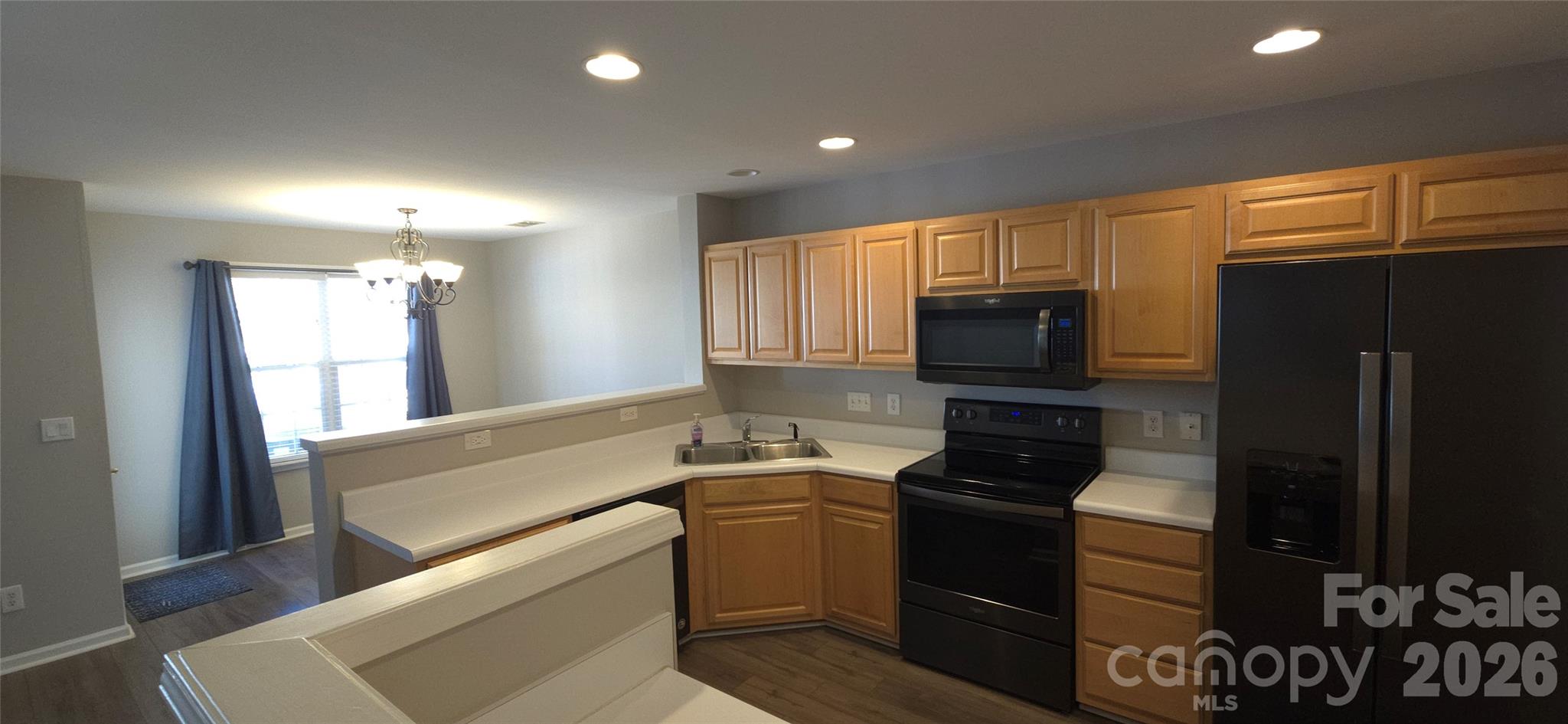 11542 Rabbit Ridge Road Charlotte, NC 28270 - Photo 10 of 33 a kitchen with a refrigerator stove and microwave