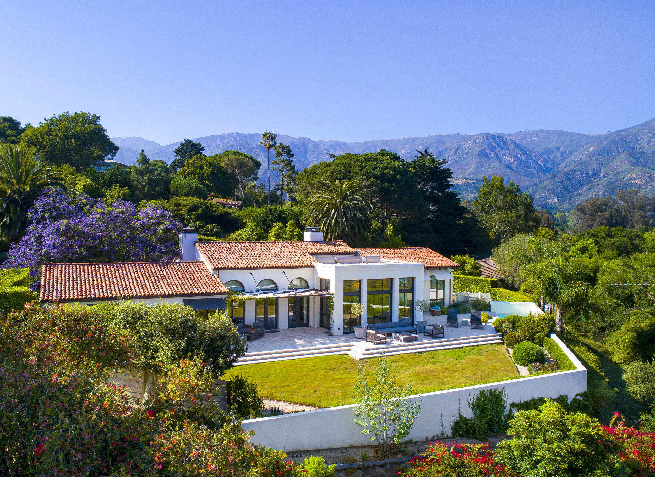 698 El Rancho Road Montecito, CA 93108 - Photo 1 of 24 a front view of house with yard and swimming pool