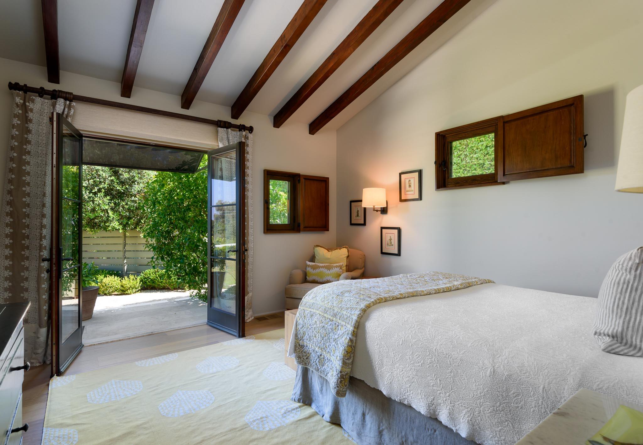 698 El Rancho Road Montecito, CA 93108 - Photo 21 of 24 a bedroom with a bed and a large window