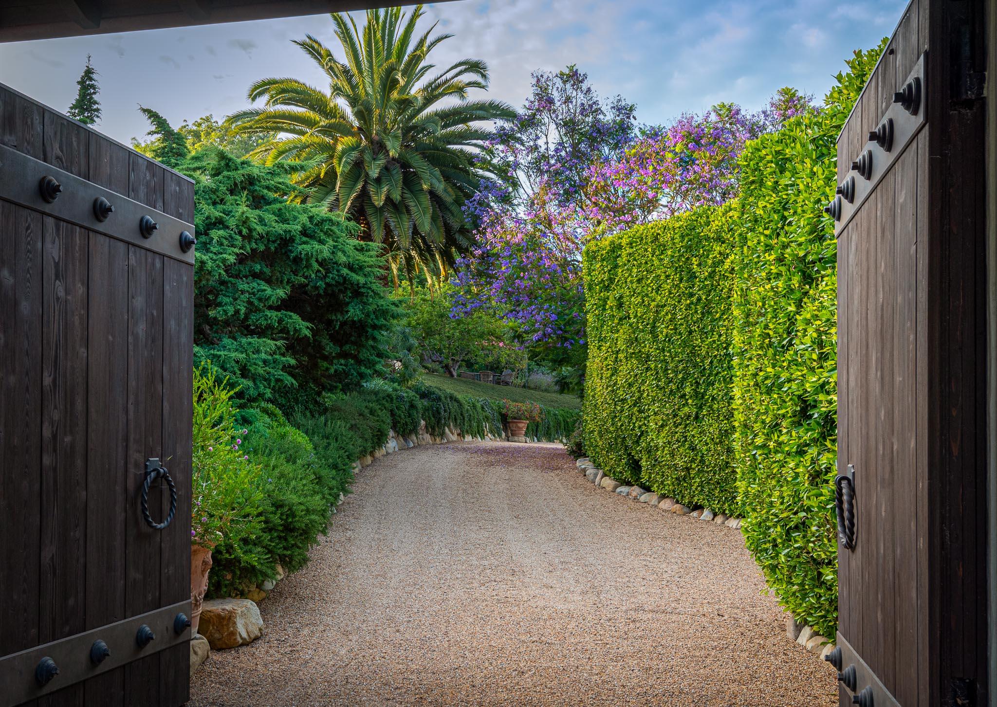 698 El Rancho Road Montecito, CA 93108 - Photo 3 of 24 a view of a backyard with plants