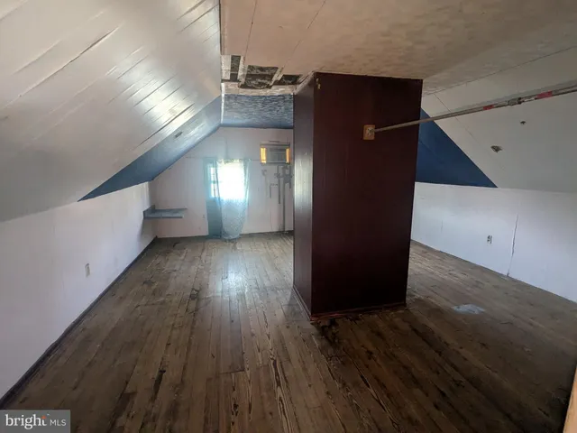 a view of gallery with wooden floor