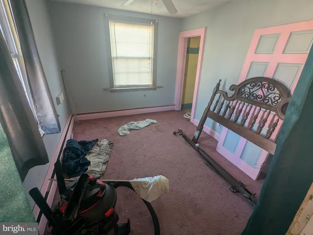 a view of a livingroom with furniture and windows
