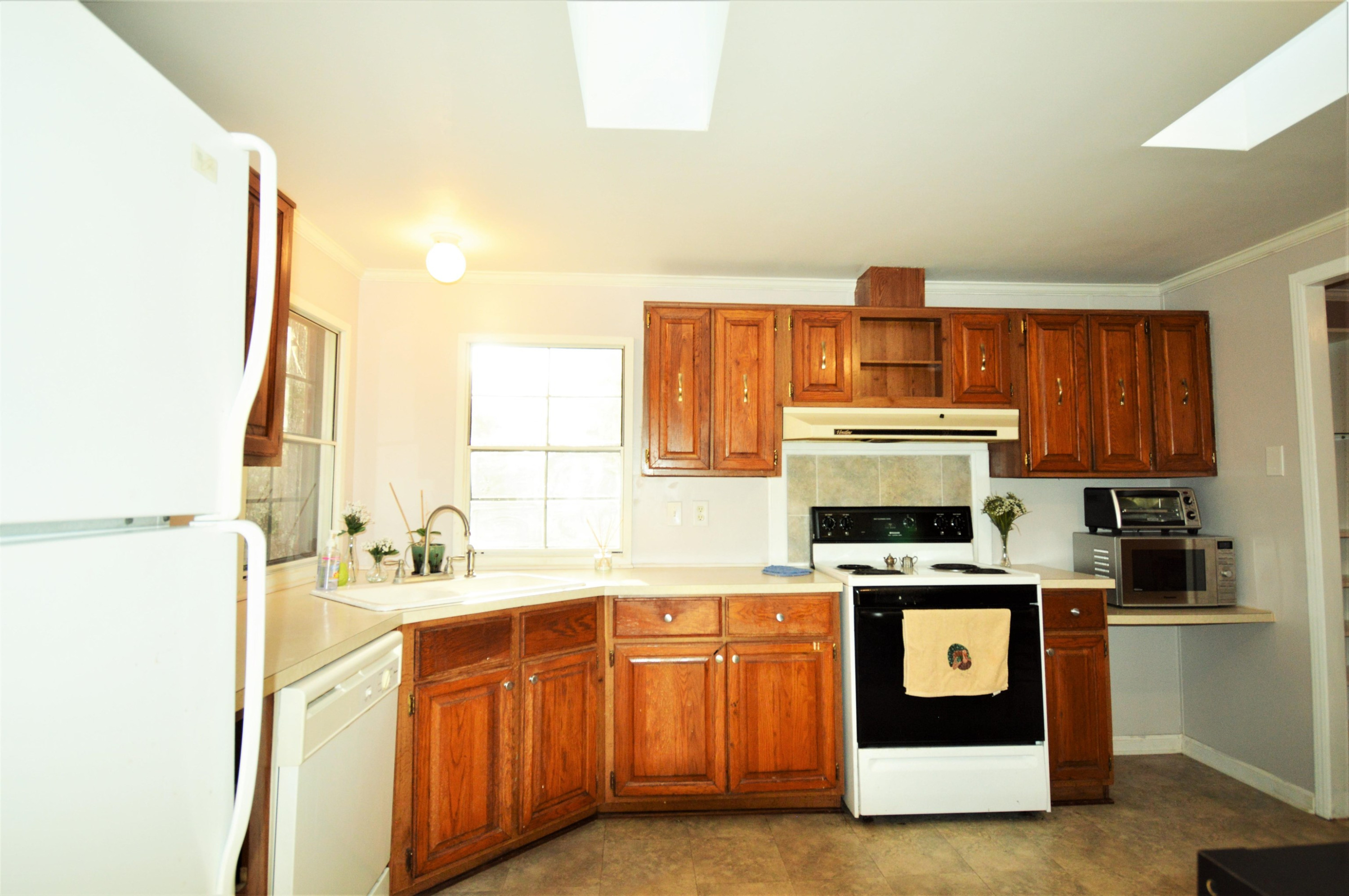 9632 Whitt Road Creedmoor, NC 27522 - Photo 8 of 30 Kitchen has one new skylight. There are 2 pantries. Kitchen