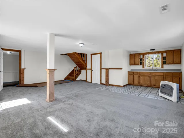 a room with a sink and cabinets