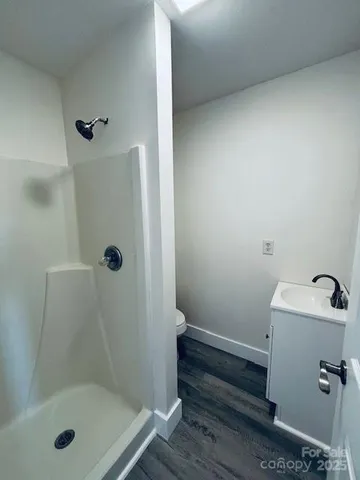 a view of a livingroom with furniture and staircase