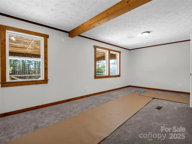 a bathroom with a sink toilet and window