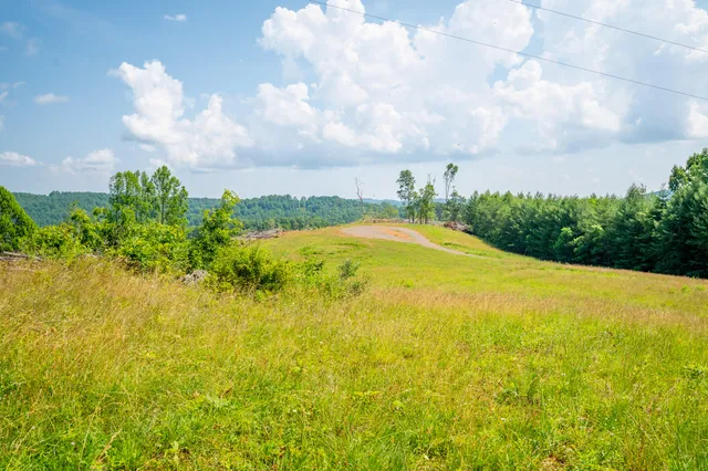 a view of a swimming pool with an outdoor space and seating area