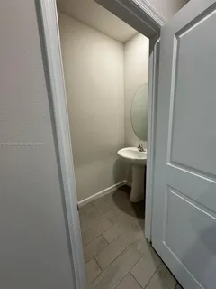 a bathroom with a sink and toilet