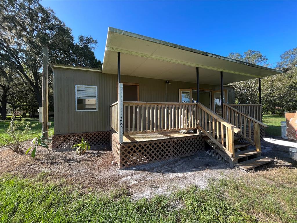 11127 McMullen Road Riverview, FL 33569 - Photo 11 of 23 a view of a house with backyard and porch