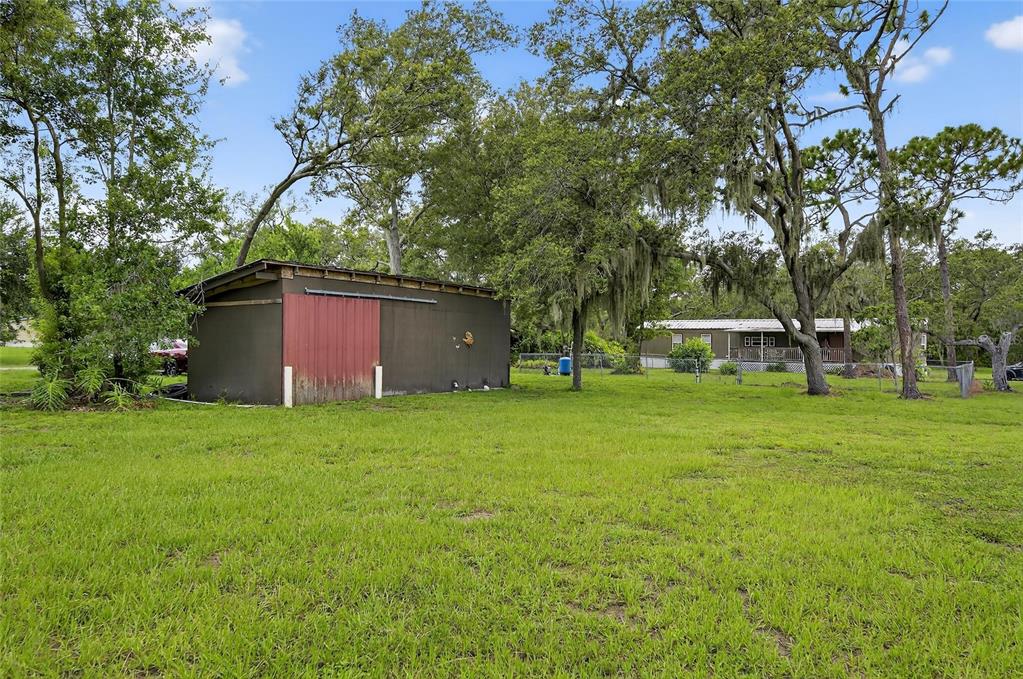 11127 McMullen Road Riverview, FL 33569 - Photo 17 of 23 a view of a yard with a house