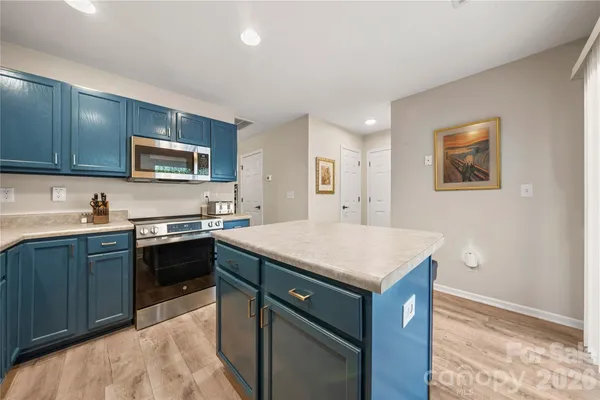 a kitchen with a stove and a sink