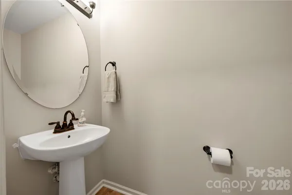 a bathroom with a sink and mirror