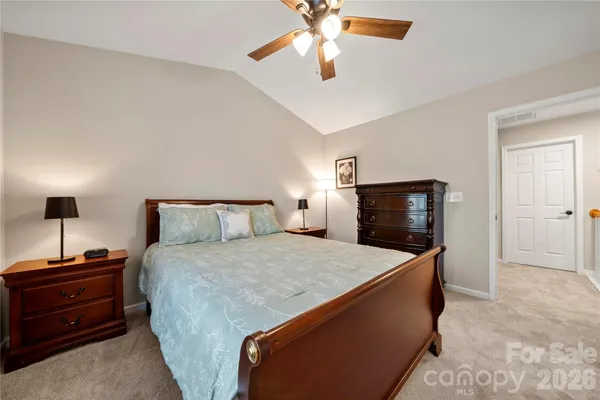 a bedroom with a bed and a tv