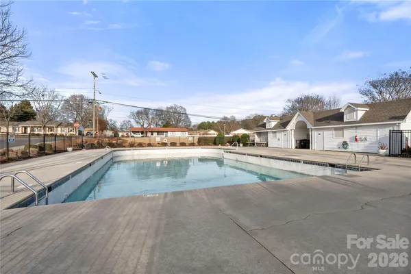 a view of swimming pool with outdoor seating