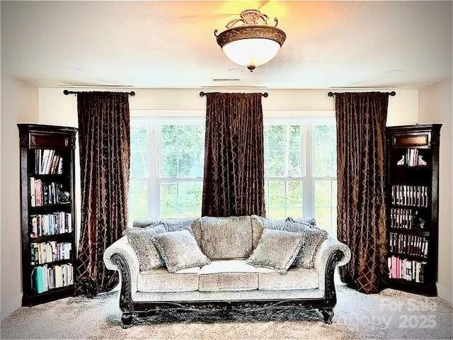 a bedroom with a bed and a large window with outer view