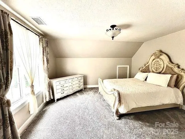 a bathroom with a sink vanity mirror and tub