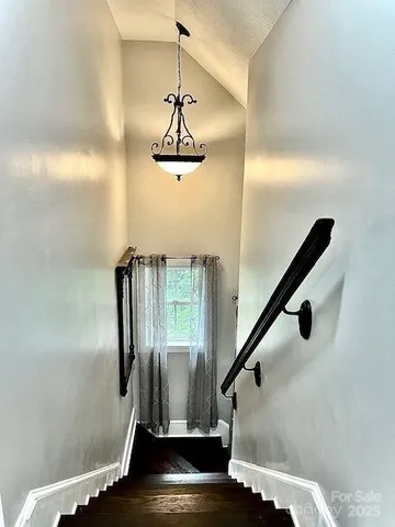 a view of a garden with a building in the background