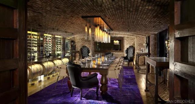 an outdoor sitting area with a table and chairs