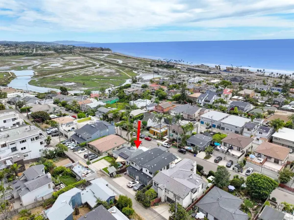 an aerial view of residential houses with outdoor space